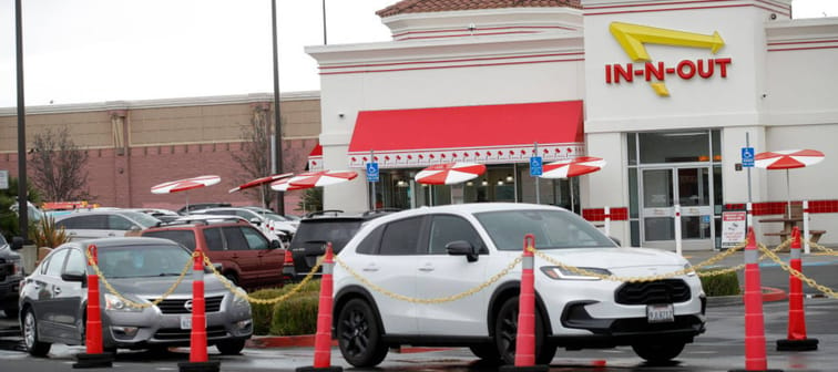 Customers line up at the In-N-Out Burger drive-thru off Hegenberger Road in Oakland, Calif.,