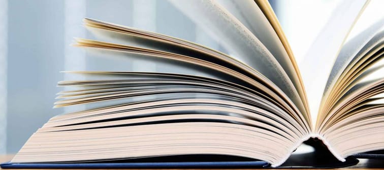 Hardcover book lying open on a table