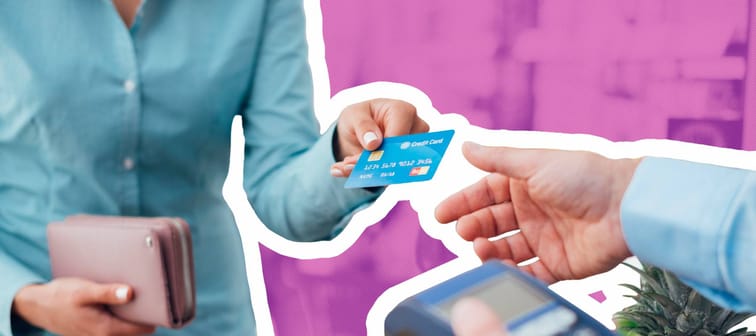 Woman at the supermarket checkout, she is paying using a credit card, shopping and retail concept